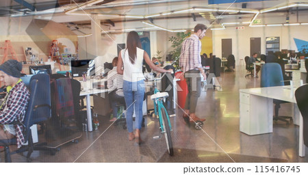 Image of hands using laptop, over colleagues at creative office with bike and on hoverboard Image of hands using laptop, over colleagues at creative office with bike and on hoverboard 115416745