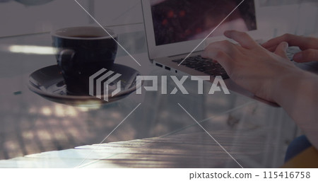 Image of hands of woman with coffee using laptop, over sped up commuters walking in city Image of hands of woman with coffee using laptop, over sped up commuters walking in city 115416758