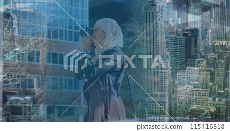 Image of asian woman in hijab with camera over cityscape Image of asian woman in hijab with camera over cityscape 115416818