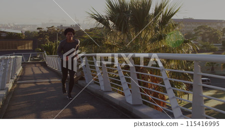 Image of media icons over african american man running Image of media icons over african american man running 115416995