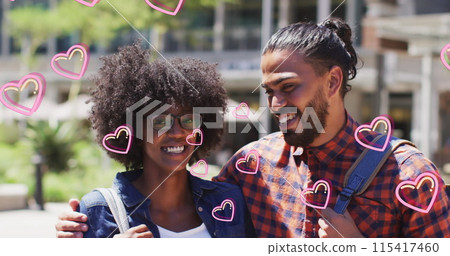Image of falling hearts over biracial couple in the street 115417460