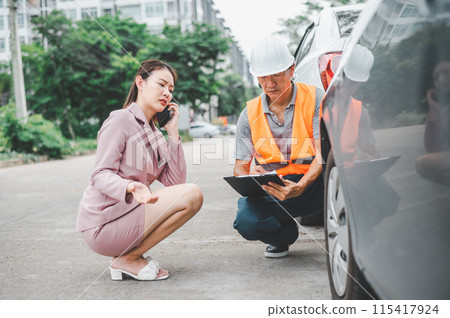 male insurance officer came to help inspect a customer's car that had an accident. Concept for vehicle crash, insurance claim. male insurance officer came to help inspect a customer's car that had an accident. Concept for vehicle crash, insurance claim. 115417924