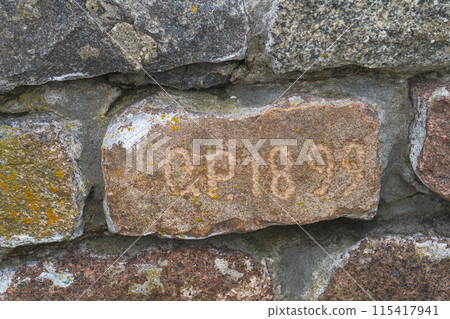 Old brick with inscription O.P. 1899. Part of brick wall. Baltiysk 115417941