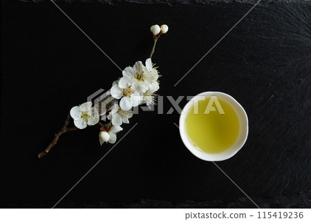 Green tea with white flowers. Green tea with white flowers. 115419236