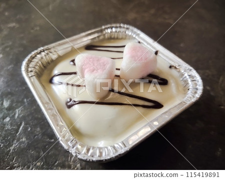 a dessert with a beautiful combination of delicious cheese, chocolate and candy a dessert with a beautiful combination of delicious cheese, chocolate and candy 115419891