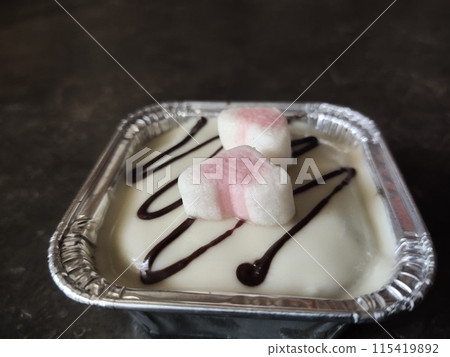 a dessert with a beautiful combination of delicious cheese, chocolate and candy 115419892