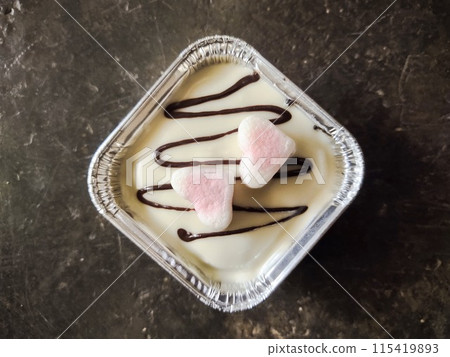 a dessert with a beautiful combination of delicious cheese, chocolate and candy a dessert with a beautiful combination of delicious cheese, chocolate and candy 115419893