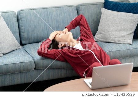 Woman in a tracksuit stress Woman in a tracksuit stress 115420559