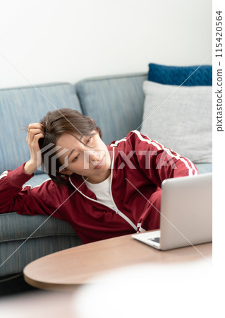 Woman in a tracksuit stress 115420564