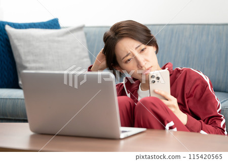 Woman in a tracksuit stress 115420565