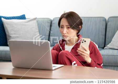 Woman in a tracksuit stress 115420566