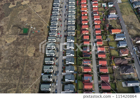European urban suburban cityscape, aerial view of residential houses and yards European urban suburban cityscape, aerial view of residential houses and yards 115420864