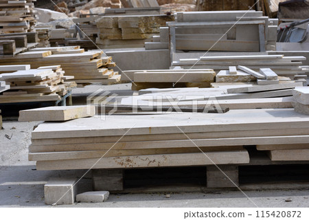 Stacked limestone slabs and tiles 115420872