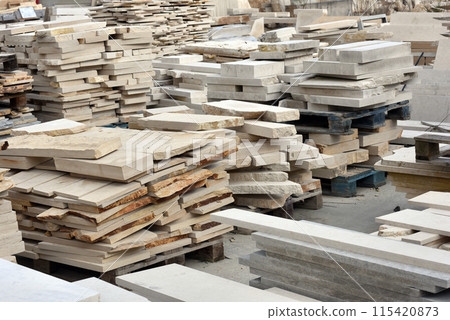 Stacked limestone slabs and tiles Stacked limestone slabs and tiles 115420873