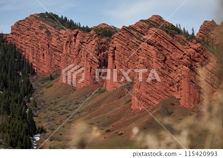 Red rocks seven oxen, 7 bulls, gorge Jety-Oguz. Popular touristic location, travel destination place in Kyrgyzstan Red rocks seven oxen, 7 bulls, gorge Jety-Oguz. Popular touristic location, travel destination place in Kyrgyzstan 115420993