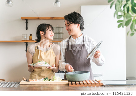 Couple, man and woman, housewife, wife, husband cooking in the kitchen 115421123