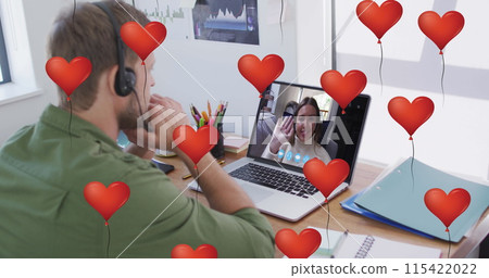 Man with headphones in a video call with a teenage girl Man with headphones in a video call with a teenage girl 115422022