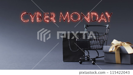 Image of cyber monday text over shopping trolley and gifts Image of cyber monday text over shopping trolley and gifts 115422043