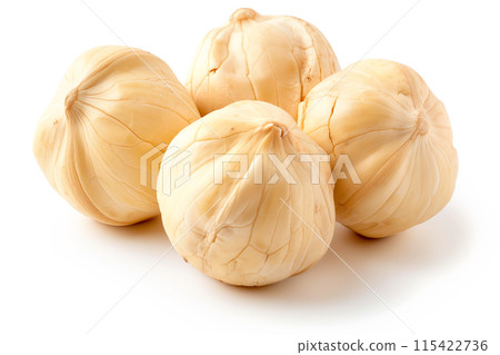Close-up of shelled and unshelled Candlenuts isolated on a white background, showcasing their texture 115422736
