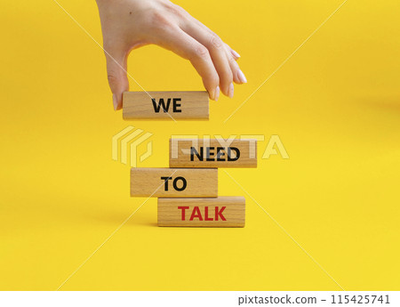 We need to talk symbol. Concept words We need to talk on wooden blocks. Beautiful yellow background. Businessman hand. Business and We need to talk concept. Copy space. We need to talk symbol. Concept words We need to talk on wooden blocks. Beautiful yellow background. Businessman hand. Business and We need to talk concept. Copy space. 115425741