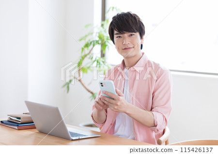 Telework: Man working from home 115426137