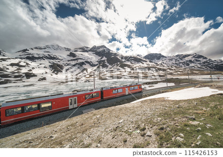 Bernina red train at the spring thaw Bernina red train at the spring thaw 115426153