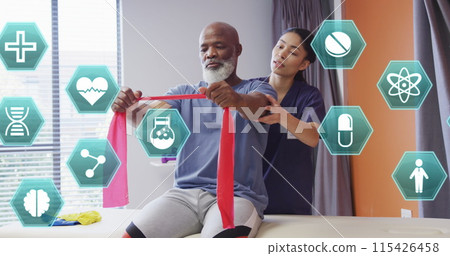 Image of medical icons over diverse female physiotherapist working with male patient Image of medical icons over diverse female physiotherapist working with male patient 115426458