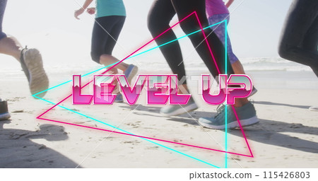 Image of text level up, in metallic pink, with legs of women running on beach Image of text level up, in metallic pink, with legs of women running on beach 115426803