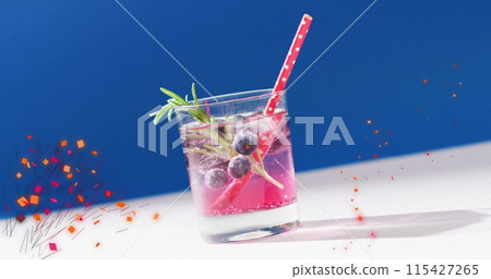 Image of confetti falling and cocktail on blue background 115427265