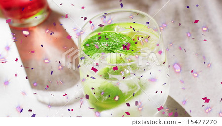 Image of confetti falling and cocktails on white background Image of confetti falling and cocktails on white background 115427270