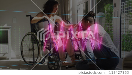 Image of neon heart rate over happy biracial couple, woman on wheelchair 115427563