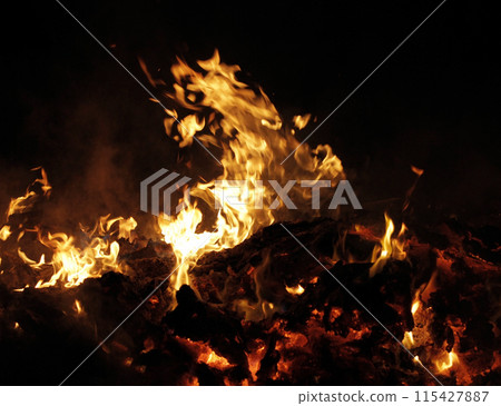 Industrial garbage burning at night time close up 115427887