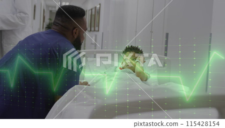 Image of green vital signs monitor over african american male doctor and boy patient in bed Image of green vital signs monitor over african american male doctor and boy patient in bed 115428154
