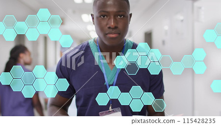 Image of hexagonal structures processing data over smiling african american male doctor 115428235