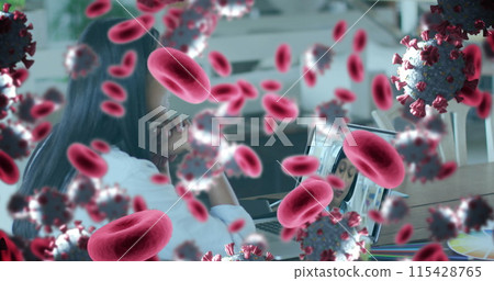 Image of covid 19 cells and red blood cells over businesswoman using laptop Image of covid 19 cells and red blood cells over businesswoman using laptop 115428765