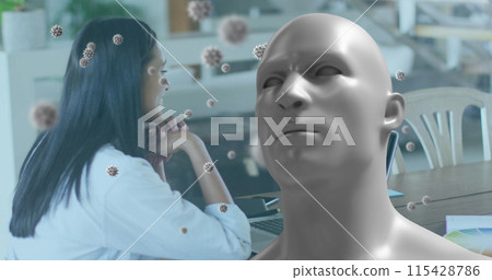 Image of human bust and covid 19 cells over businesswoman on laptop image call 115428786