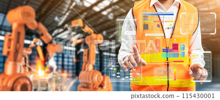Technician or engineer work with robotic arms in factory 115430001