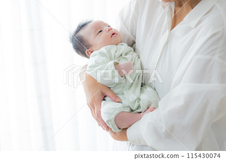 Family holding a baby 115430074