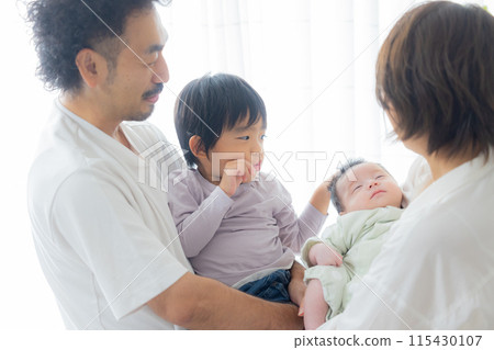 Family of four with baby 115430107