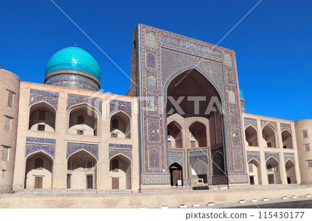 Facade of Mir i Arab madrassa, Bukhara, Uzbekistan. Madrasah Mir Arab, Poi-Kalyan (Poi Kalon) islamic religious complex in old town in Bukhara. Inscription above the entrance is a quote from the Koran 115430177