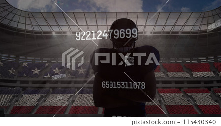 Multiple changing numbers over silhouette of male rugby player against sports stadium in background 115430340