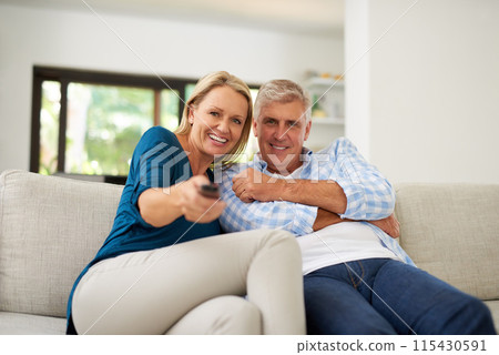 Sofa, couple and portrait with tv remote in living room for streaming service, entertainment and search. Mature man, woman and relax at home with television for online movie, film and media broadcast 115430591