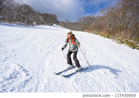 Mother enjoying skiing Mother enjoying skiing 115430809