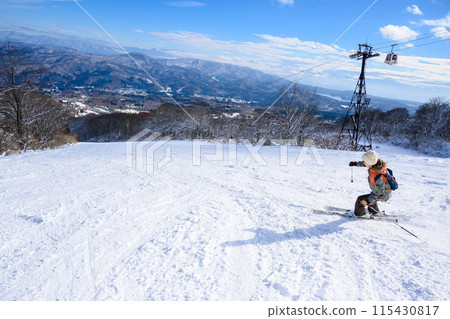 Mother enjoying skiing Mother enjoying skiing 115430817