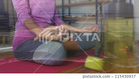 Image of wave over biracial women practicing yoga Image of wave over biracial women practicing yoga 115430937
