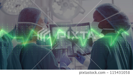 Image of cardiograph over diverse surgeons working at hospital 115431058