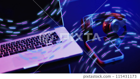Image of neon light trails over image game computer equipment Image of neon light trails over image game computer equipment 115431173