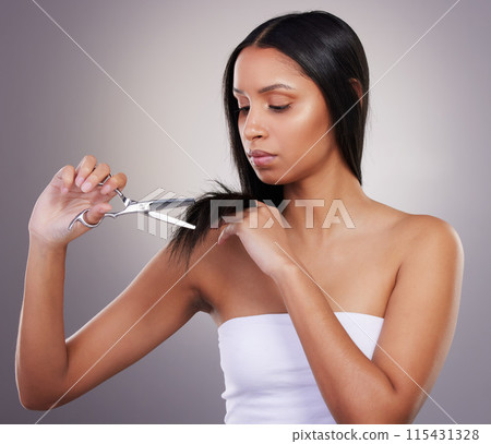 Woman, scissors and hair cut for spit ends, grooming and trimming on studio grey background. Female person, beauty and salon style for fresh glow, maintenance and keratin treatment or collagen Woman, scissors and hair cut for spit ends, grooming and trimming on studio grey background. Female person, beauty and salon style for fresh glow, maintenance and keratin treatment or collagen 115431328