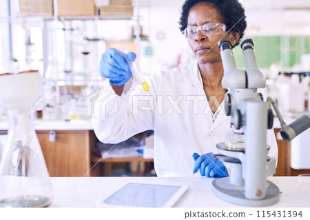 Black woman, test tube sample and in lab for science, innovation and medical healthcare development. Scientist, microscope and chemistry experiment for discovery, breakthrough and vaccine research 115431394