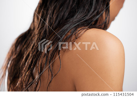 Person, back and closeup in studio with hair care, skincare and relaxation after shower. Beauty, wet and shoulder of woman for thinking, hygiene and smooth skin from treatment in bathroom for health 115431504